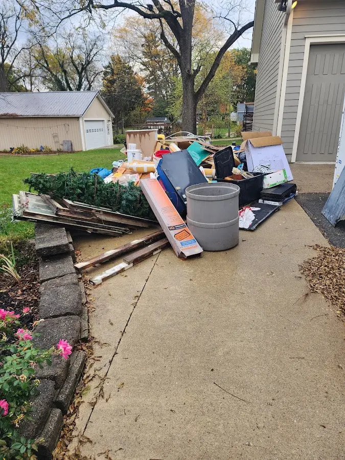 Dumpster being loaded with debris for Estate Cleanout Dumpster Rental in Hammonton